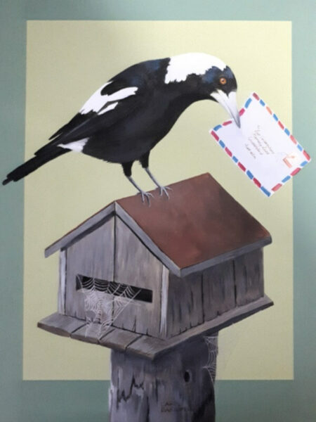 Magpie sitting on letter box with air-letter in his beak.