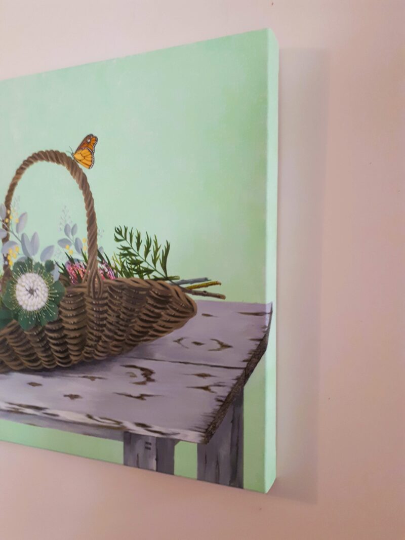 Side view of painting of native wild flowers in a basket